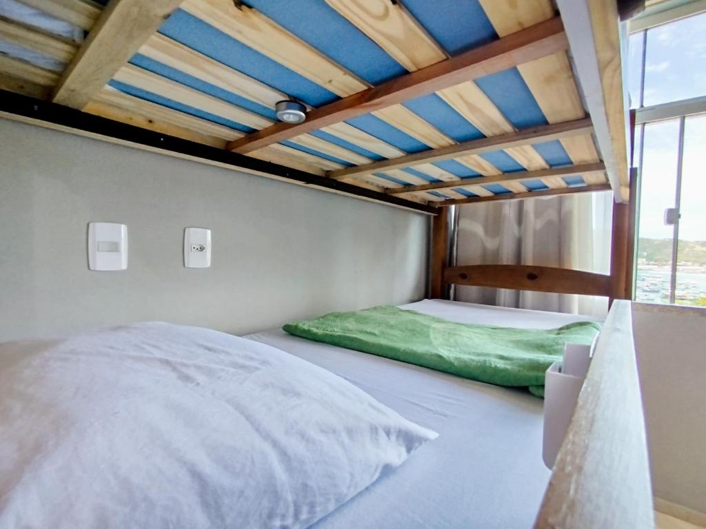 Postel nebo postele na pokoji v ubytování Hostel Casa da Pedra