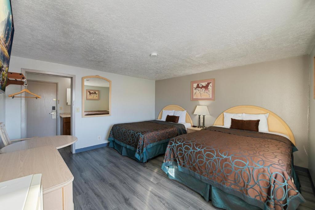 Postel nebo postele na pokoji v ubytování Budget Motel - Delta, Utah
