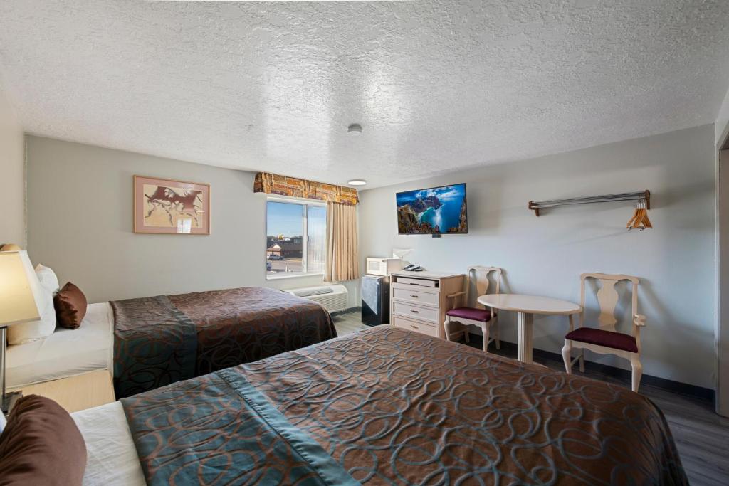 Postel nebo postele na pokoji v ubytování Budget Motel - Delta, Utah