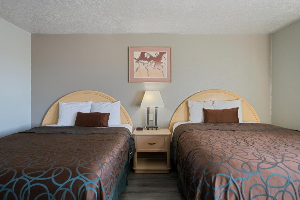 Postel nebo postele na pokoji v ubytování Budget Motel - Delta, Utah