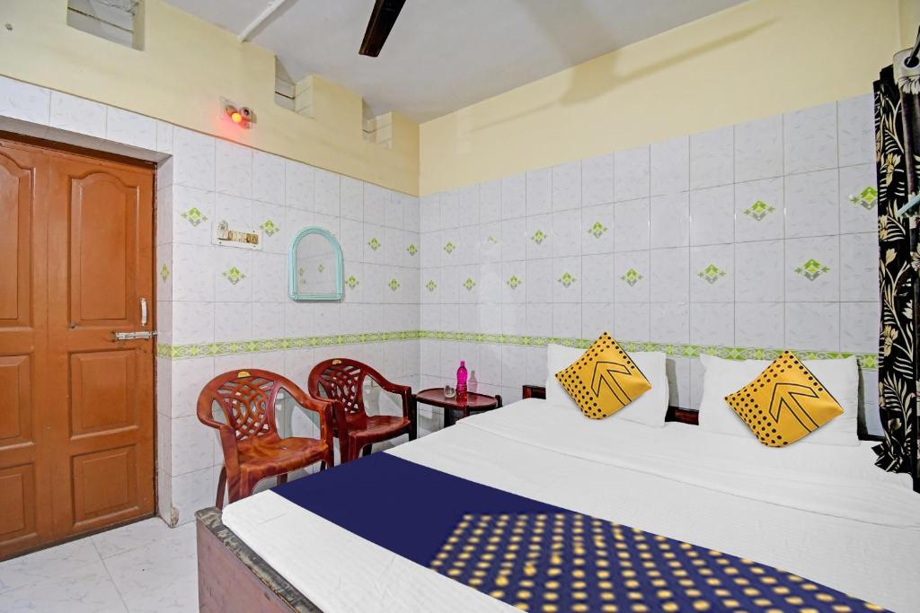 Postel nebo postele na pokoji v ubytování Hotel O Bikram Lodge