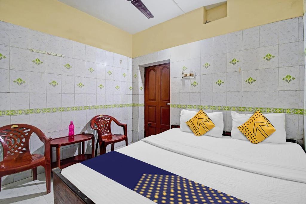 Postel nebo postele na pokoji v ubytování Hotel O Bikram Lodge