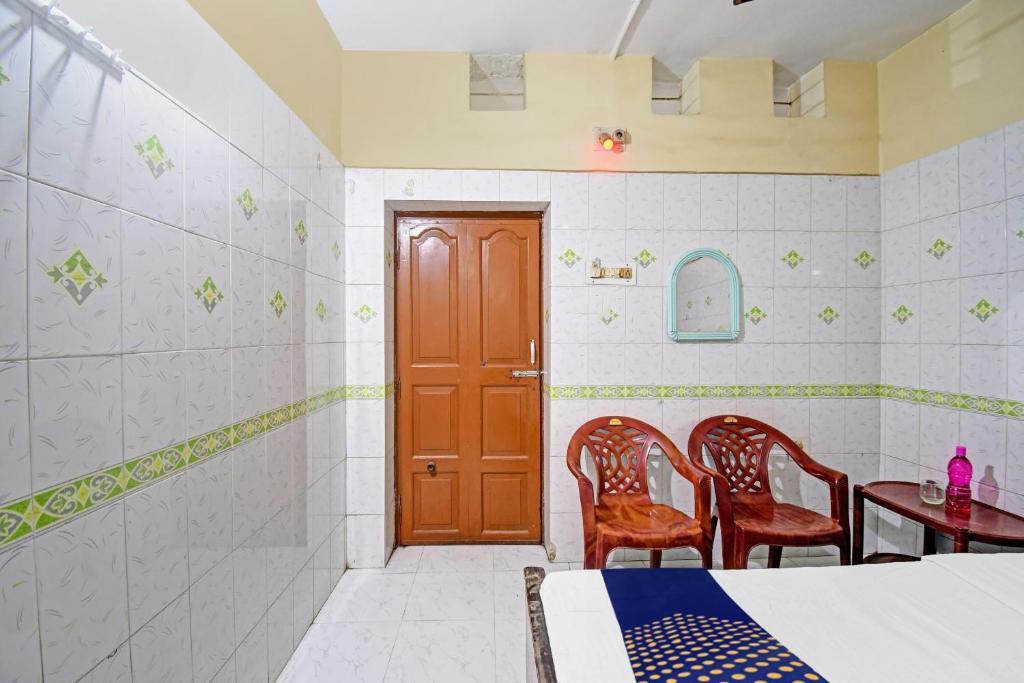 Postel nebo postele na pokoji v ubytování Hotel O Bikram Lodge
