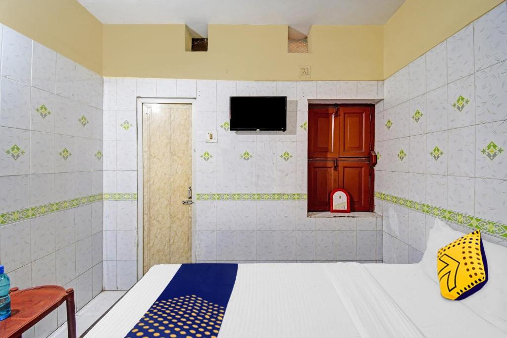 Postel nebo postele na pokoji v ubytování Hotel O Bikram Lodge