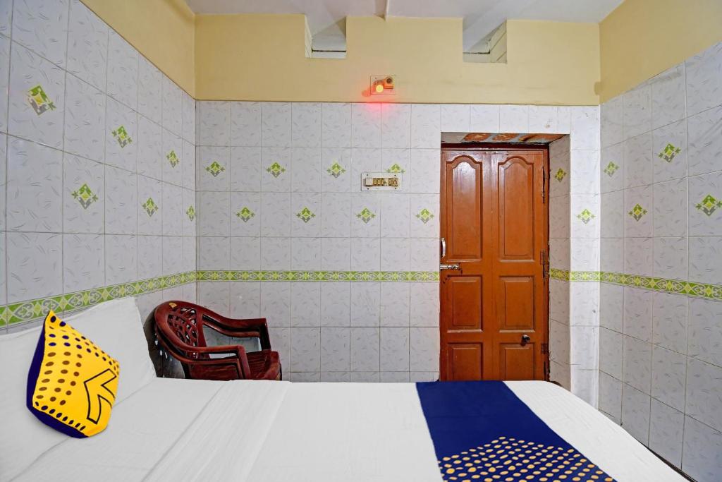 Postel nebo postele na pokoji v ubytování Hotel O Bikram Lodge