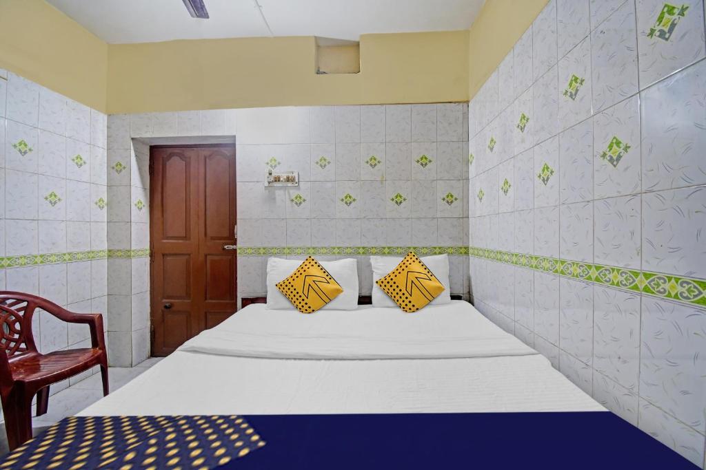 Postel nebo postele na pokoji v ubytování Hotel O Bikram Lodge