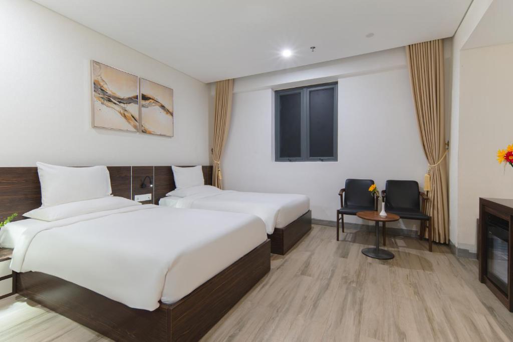 Postel nebo postele na pokoji v ubytování Emerald Bay Hotel & Spa Nha Trang