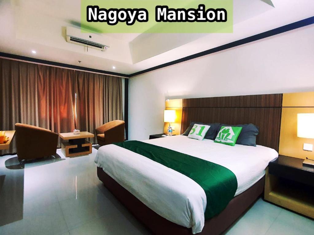 a hotel room with a large bed and a desk at Nagoya Mansion Apartment by Homestay81 in Nagoya