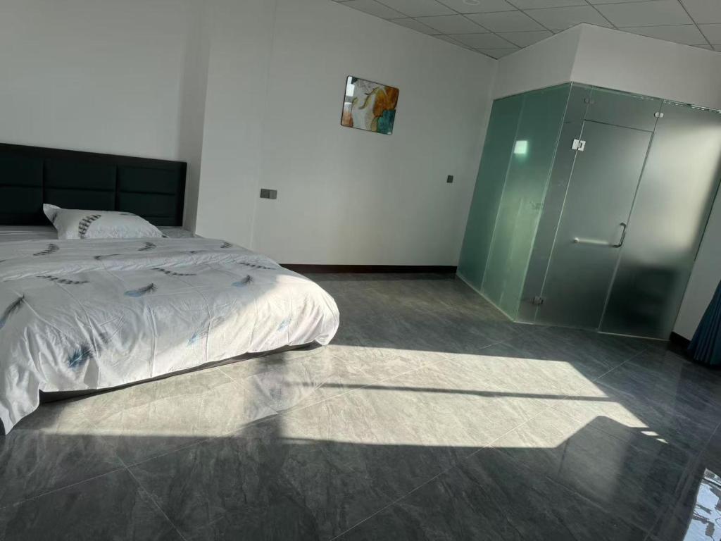 Postel nebo postele na pokoji v ubytování Zhengfeng Hotel