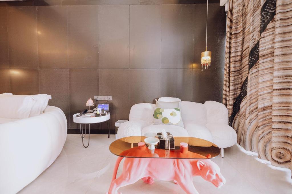 Postel nebo postele na pokoji v ubytování YUSU Hotel 羽宿酒店
