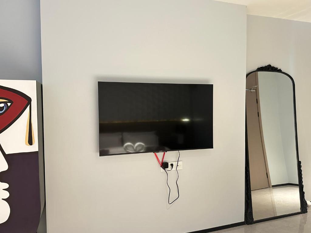 TV a/nebo společenská místnost v ubytování YUSU Hotel 羽宿酒店