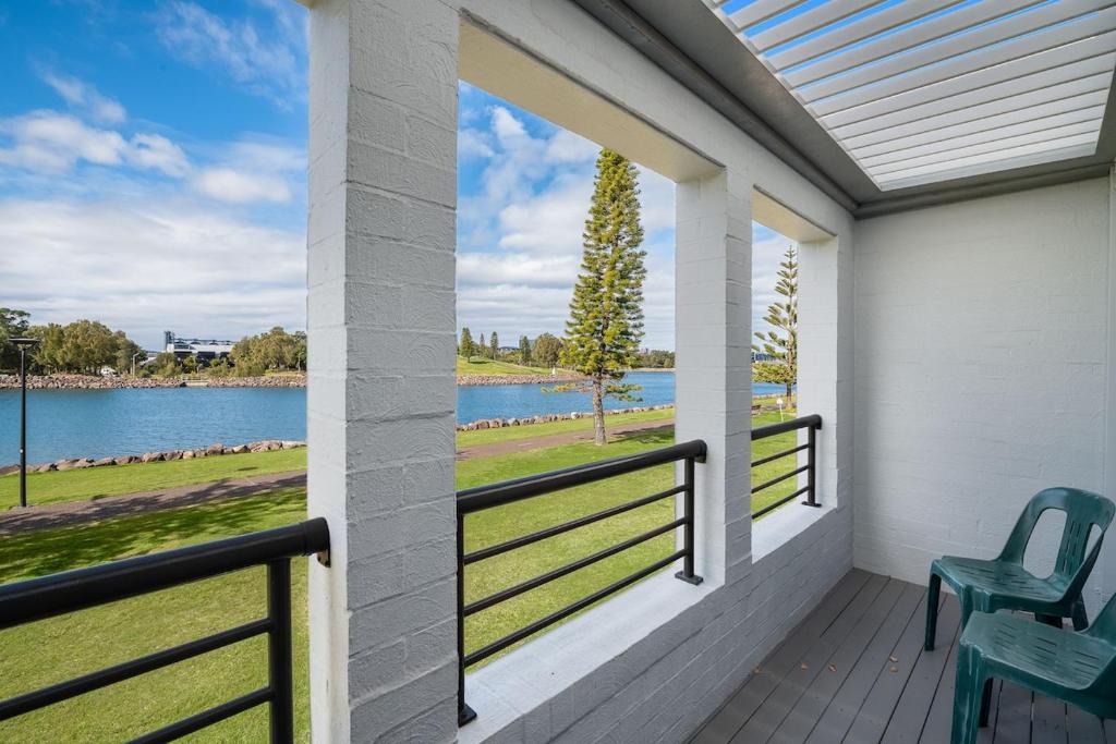 a balcony with a view of a lake at Riverside in Maryville