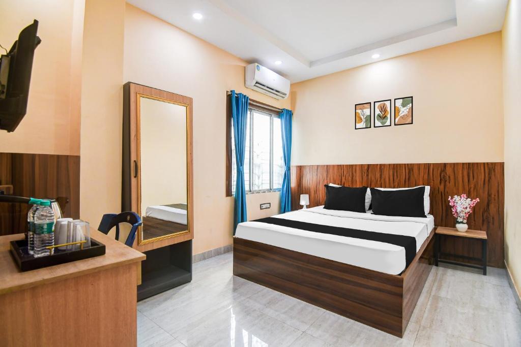 Postel nebo postele na pokoji v ubytování Super Hotel O DumDum Thana More formerly Bimla Regency