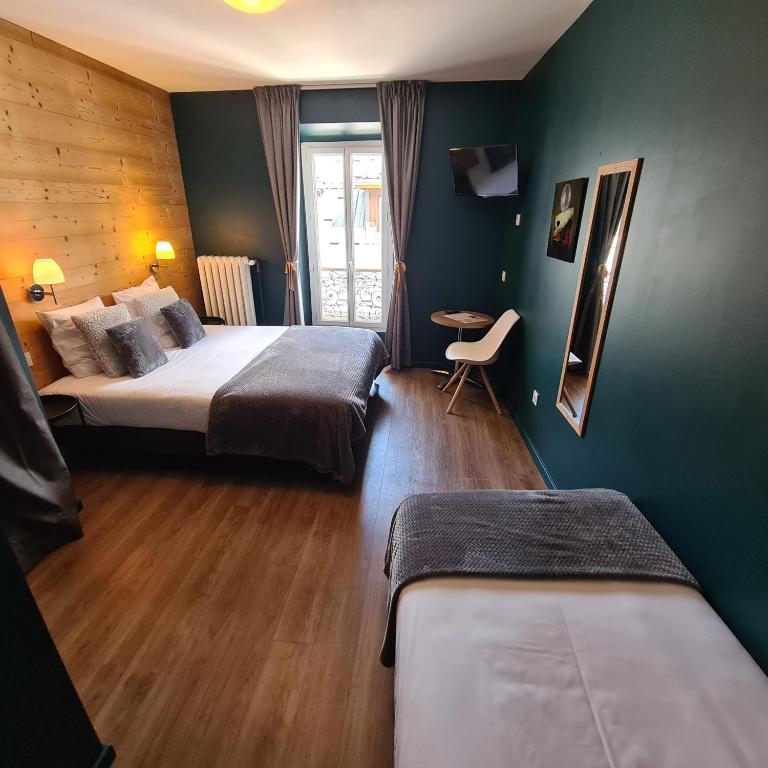Postel nebo postele na pokoji v ubytování Le Grand Hotel