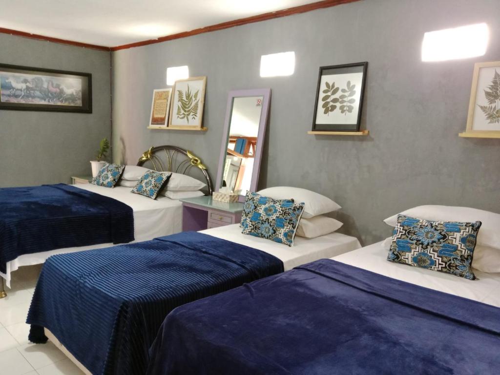 Postel nebo postele na pokoji v ubytování Villa Puri