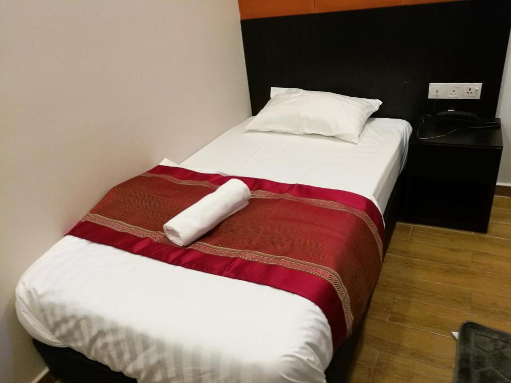 Postel nebo postele na pokoji v ubytování D'Spark Hotel Bayu