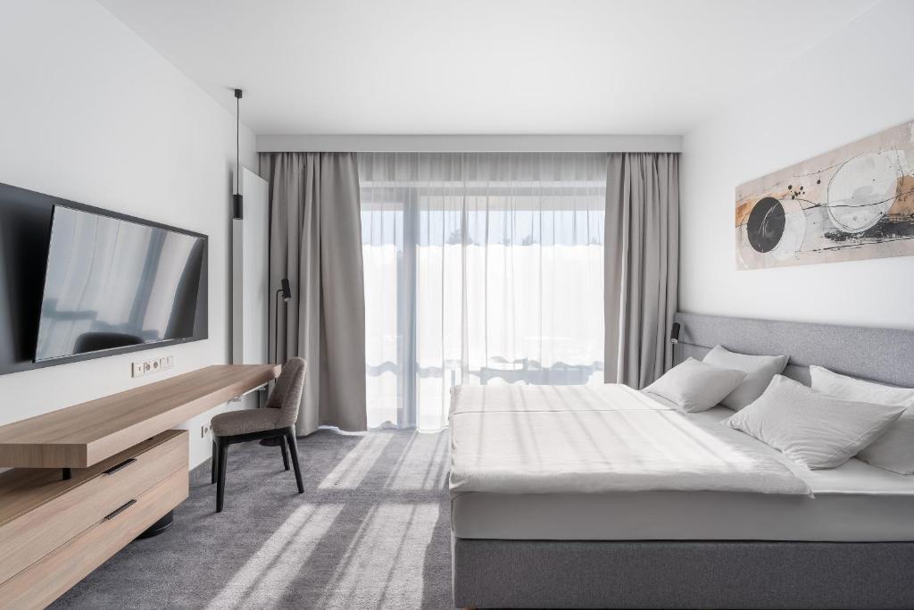 TV a/nebo společenská místnost v ubytování Shellter Hotel Resort & Spa