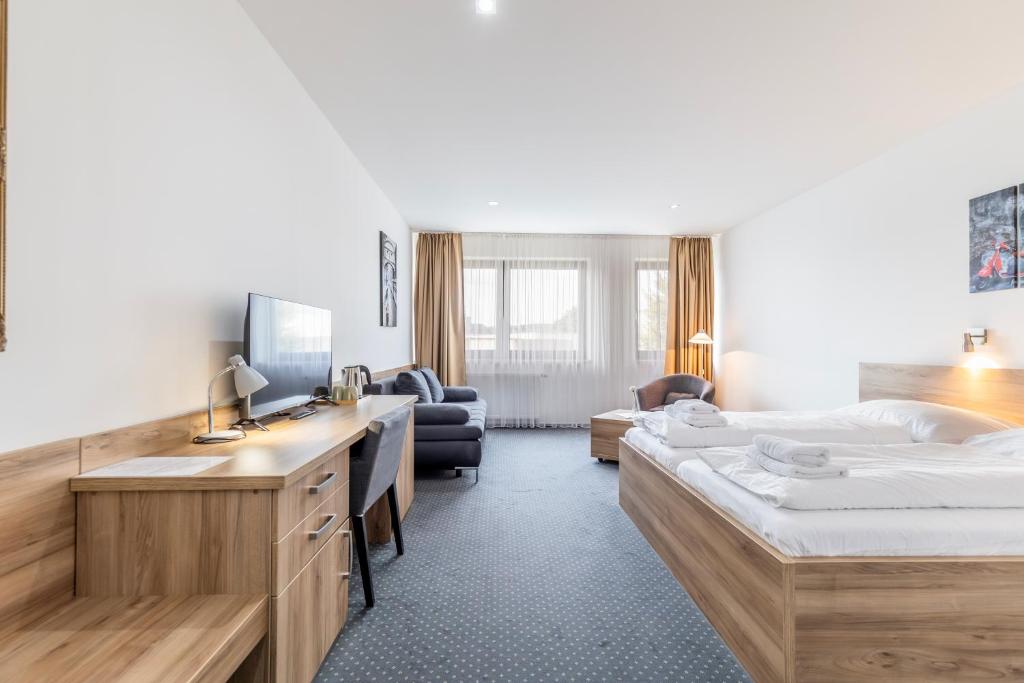 Posteľ alebo postele v izbe v ubytovaní Sport HOTEL Centrum