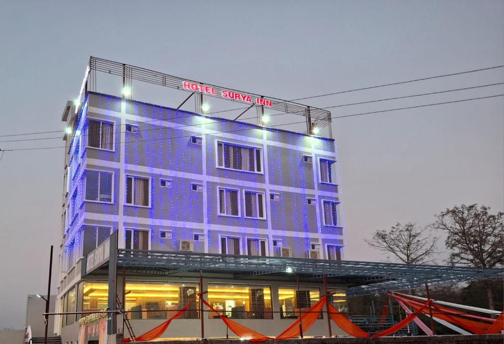 a purple building with a sign on the side of it at Hotel Surya Inn in Dehradun Airport