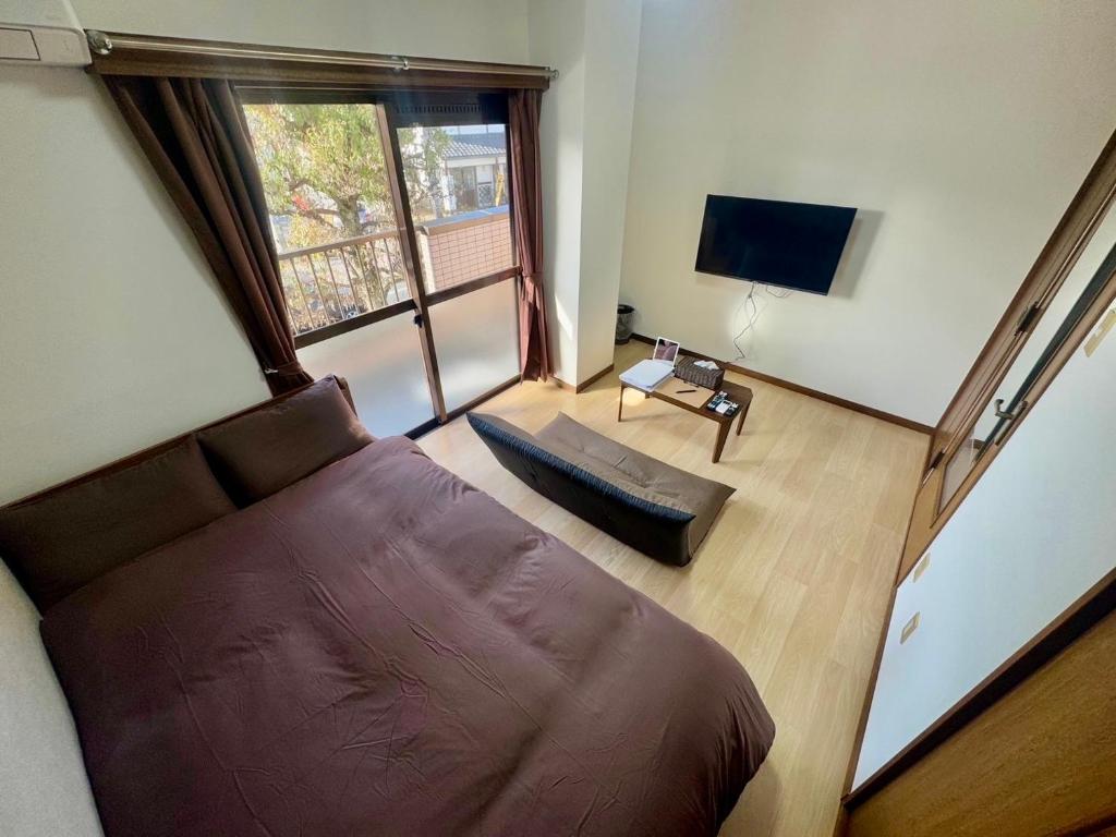 TV a/nebo společenská místnost v ubytování Apartment Hotel Kuki