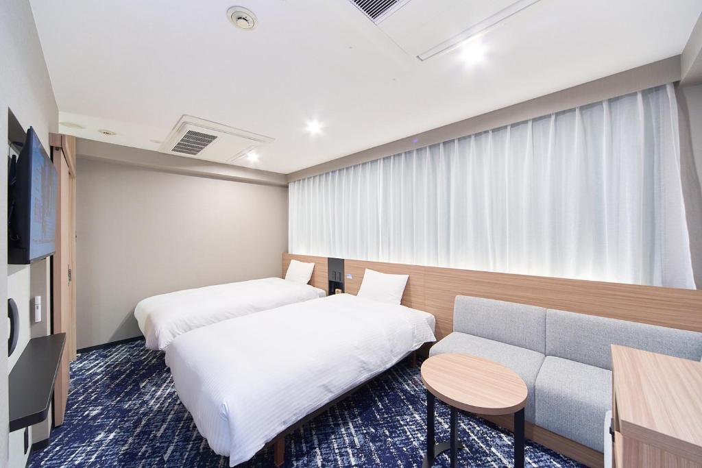 TV a/nebo společenská místnost v ubytování Washington R&B Hotel Umeda East