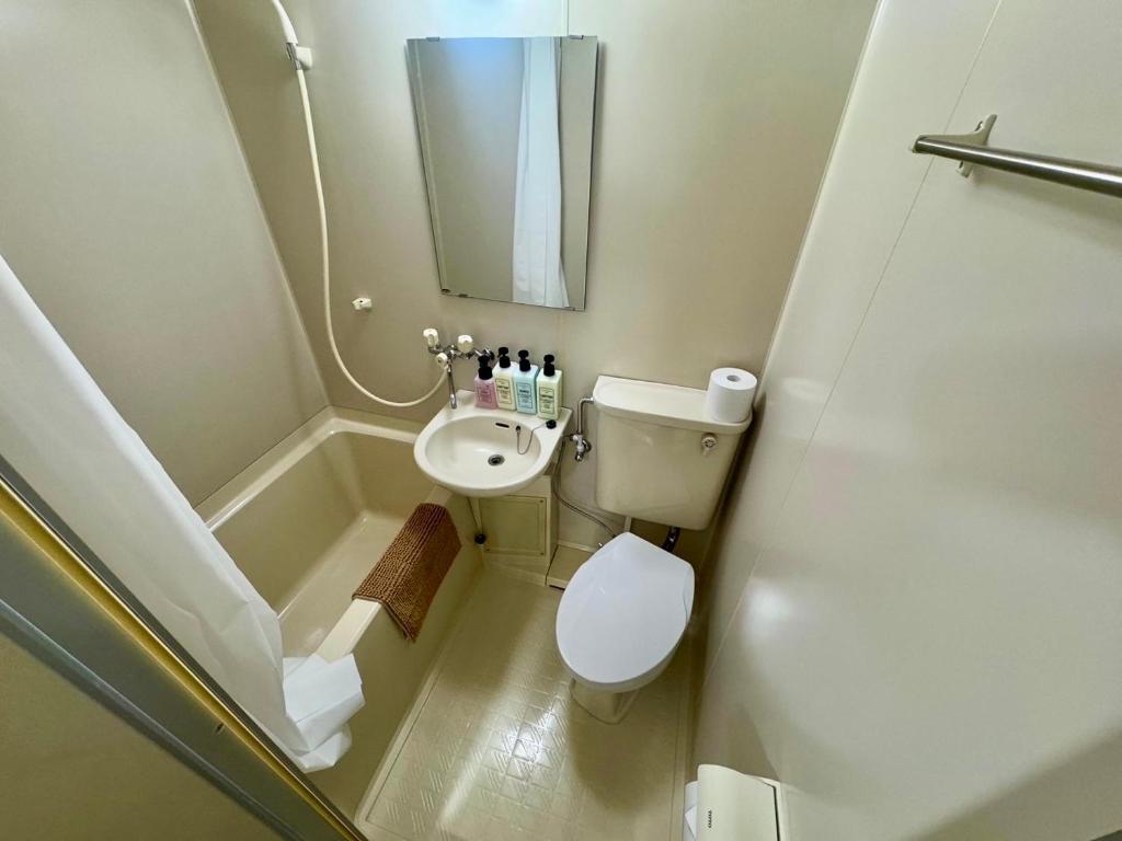 Koupelna v ubytování Apartment Hotel Kuki