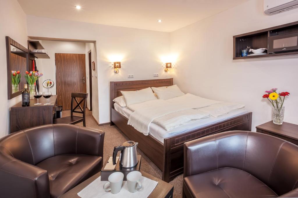 Łóżko lub łóżka w pokoju w obiekcie Hotel Kolonie
