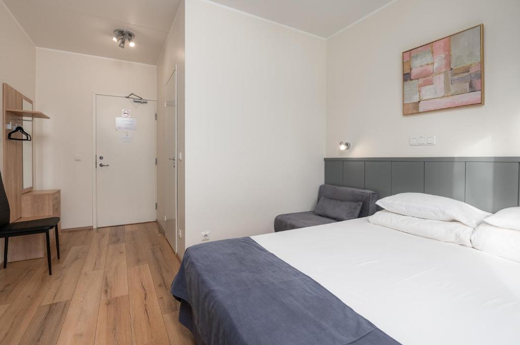 Postel nebo postele na pokoji v ubytování Hotell Tammsaare