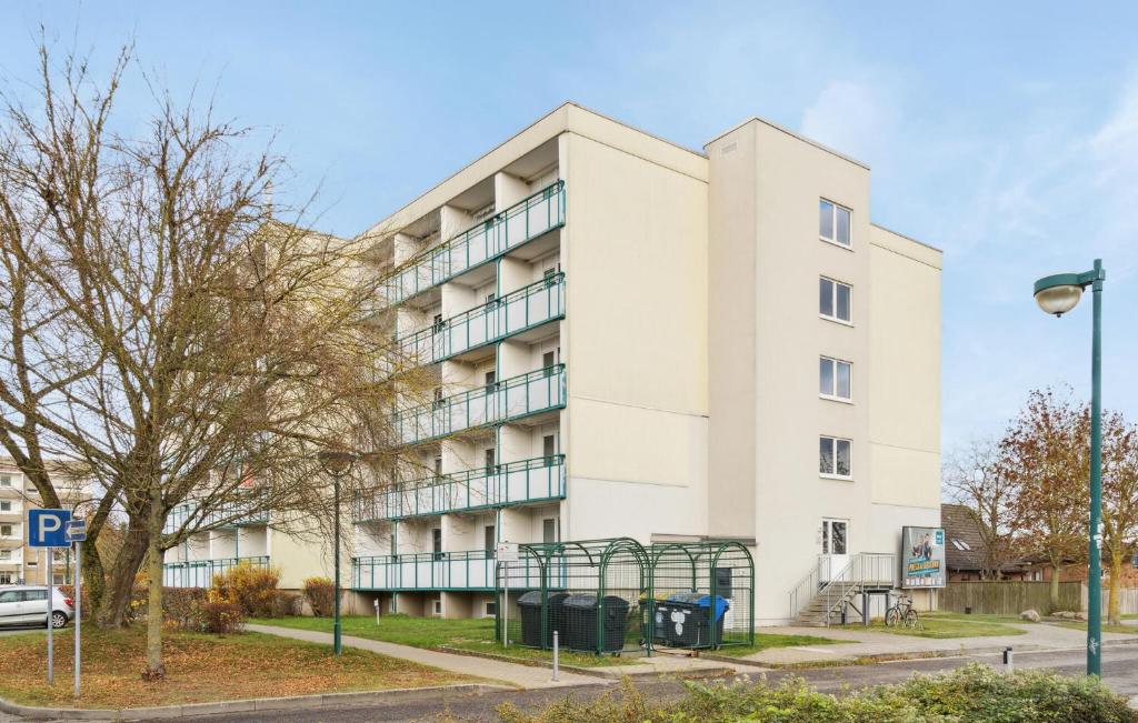 an apartment building with balconies on the side of it at 1 Bedroom Gorgeous Apartment In Anklam in Anklam