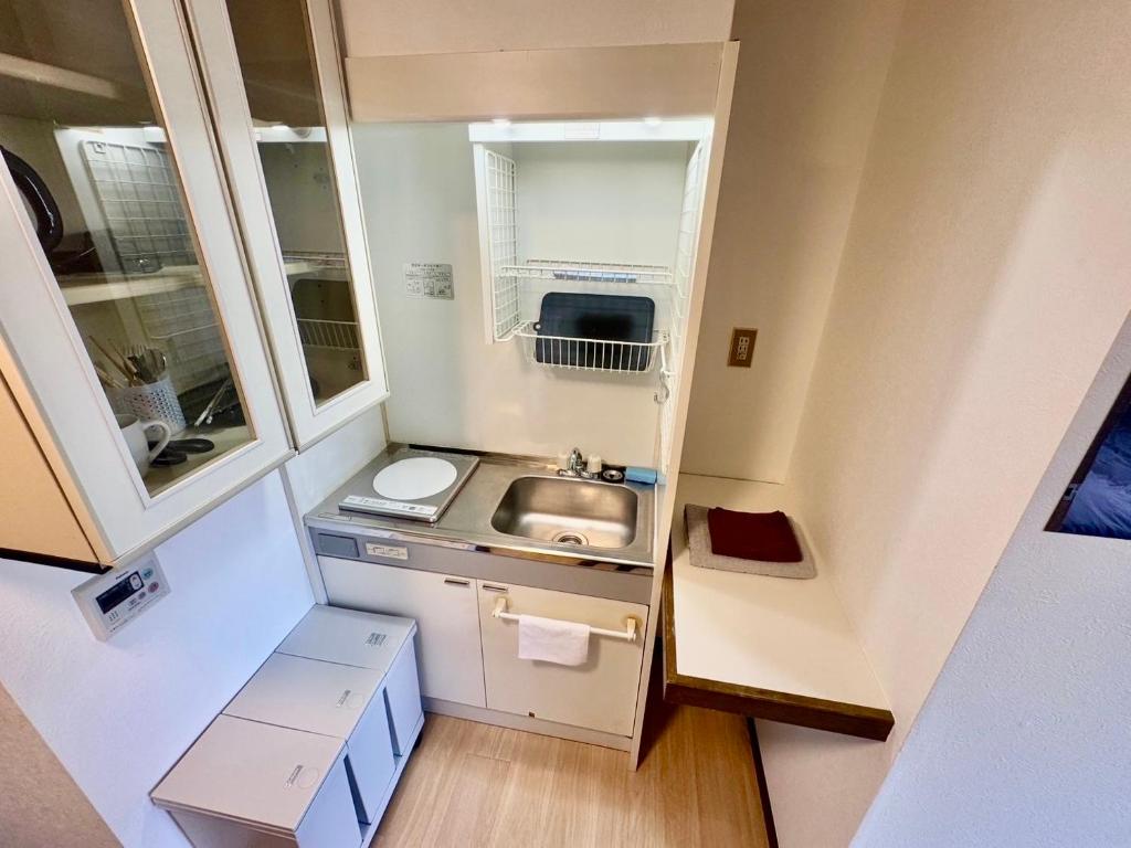 Koupelna v ubytování Apartment Hotel Kuki