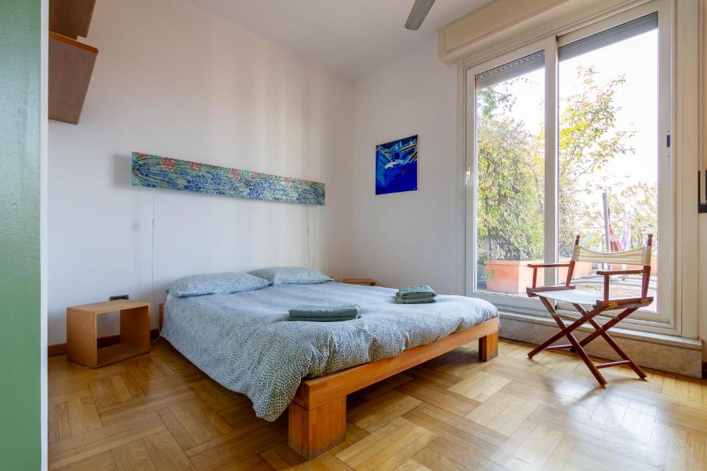 Posteľ alebo postele v izbe v ubytovaní attico con terrazzo navigli bocconi - NavigliApartments