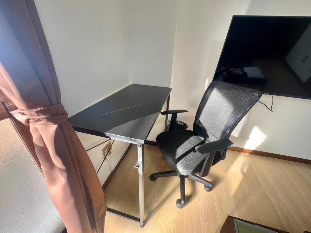 TV a/nebo společenská místnost v ubytování Apartment Hotel Kuki