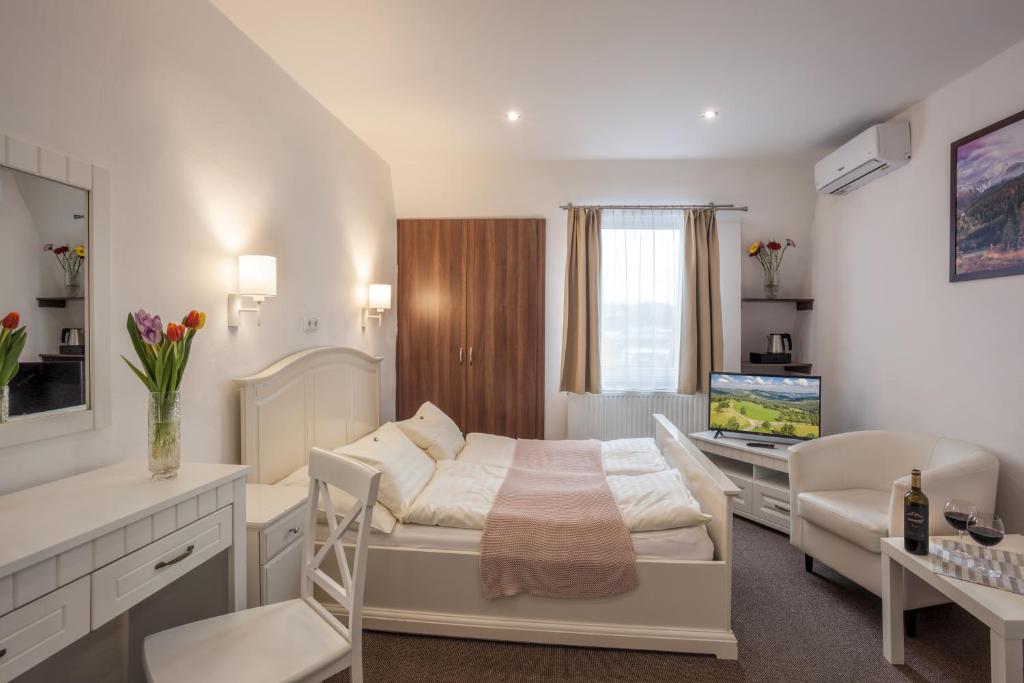 Łóżko lub łóżka w pokoju w obiekcie Hotel Kolonie