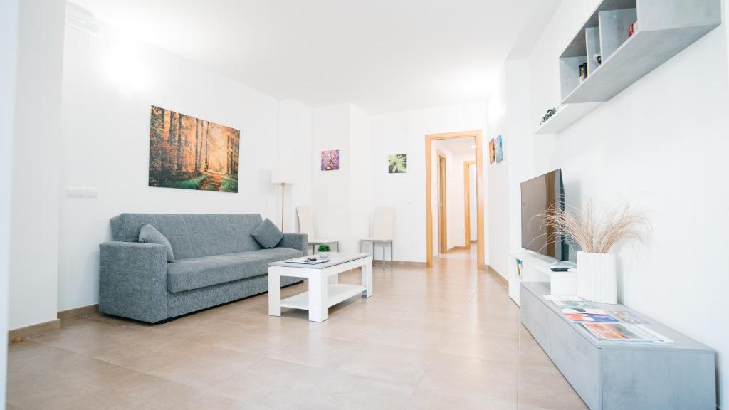 a living room with a couch and a table at Cuchillos de la fonseca in Casas de Moya