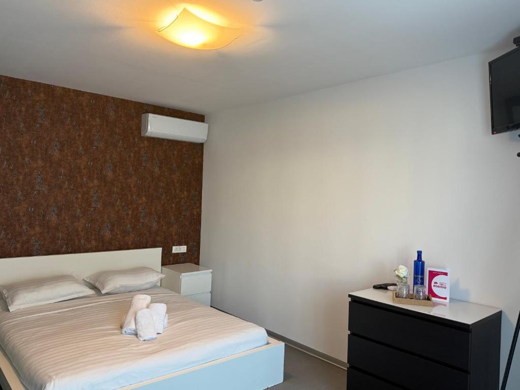 Postel nebo postele na pokoji v ubytování Rodizio Hill Resort