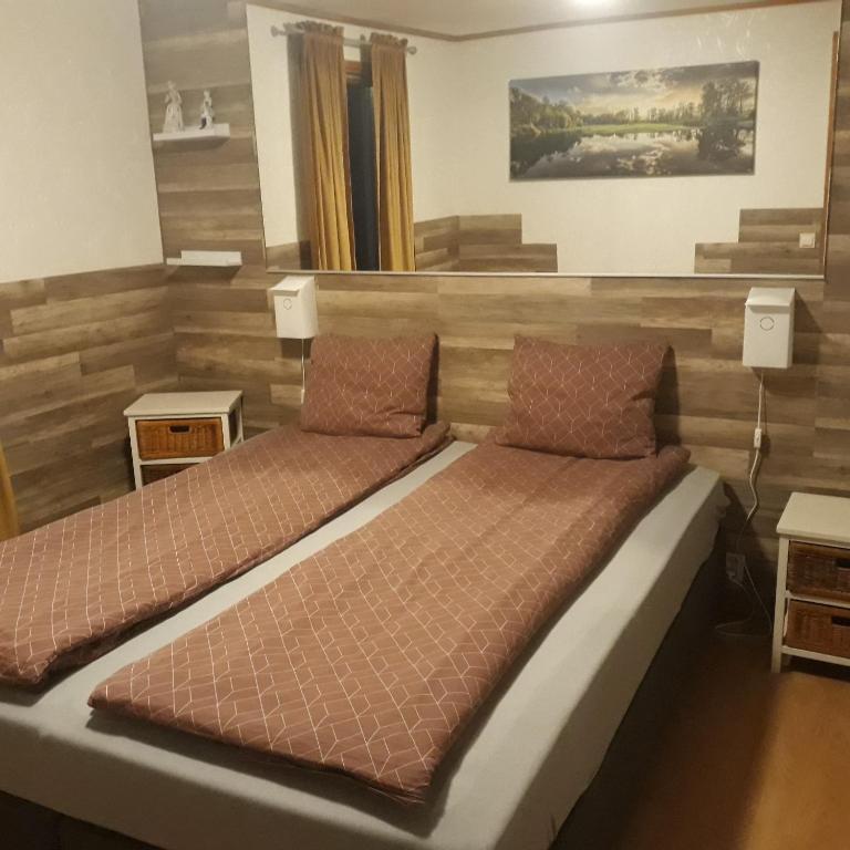 Postel nebo postele na pokoji v ubytování Minnebo stuga