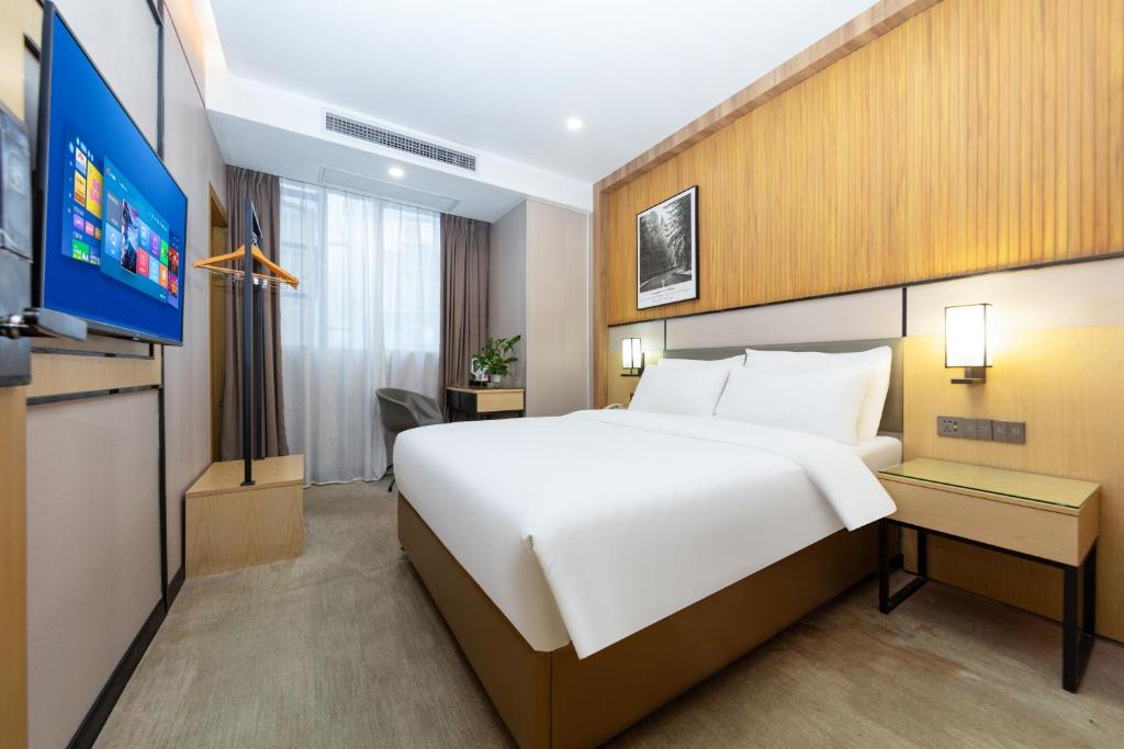 TV a/nebo společenská místnost v ubytování The Best Time Hotel Pazhou-Free shuttle bus for canton fair