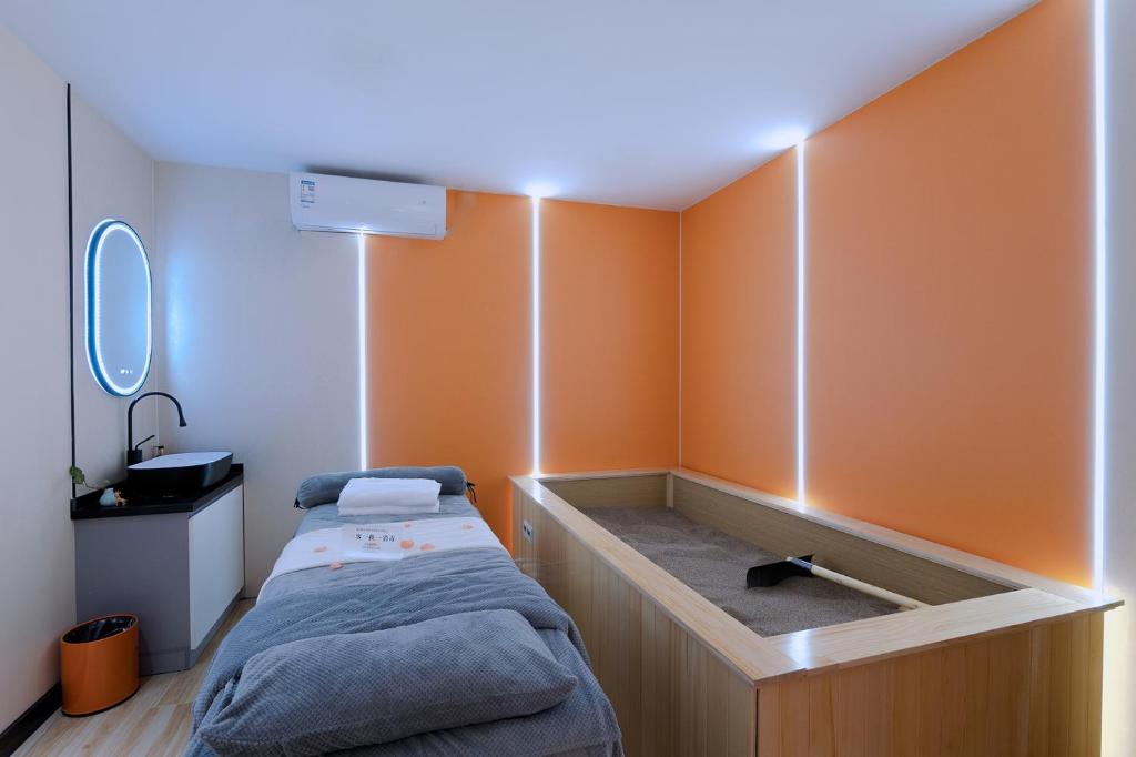 Postel nebo postele na pokoji v ubytování Andy International Hotel Shenzhen University Nanshan Metro Branch
