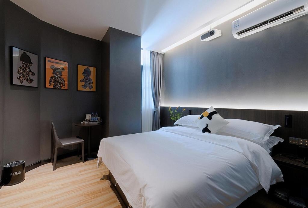 Postel nebo postele na pokoji v ubytování Andy International Hotel Shenzhen University Nanshan Metro Branch