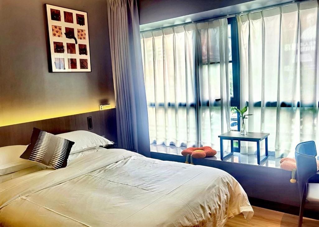 Postel nebo postele na pokoji v ubytování Andy International Hotel Shenzhen University Nanshan Metro Branch
