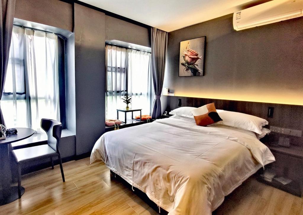 Postel nebo postele na pokoji v ubytování Andy International Hotel Shenzhen University Nanshan Metro Branch