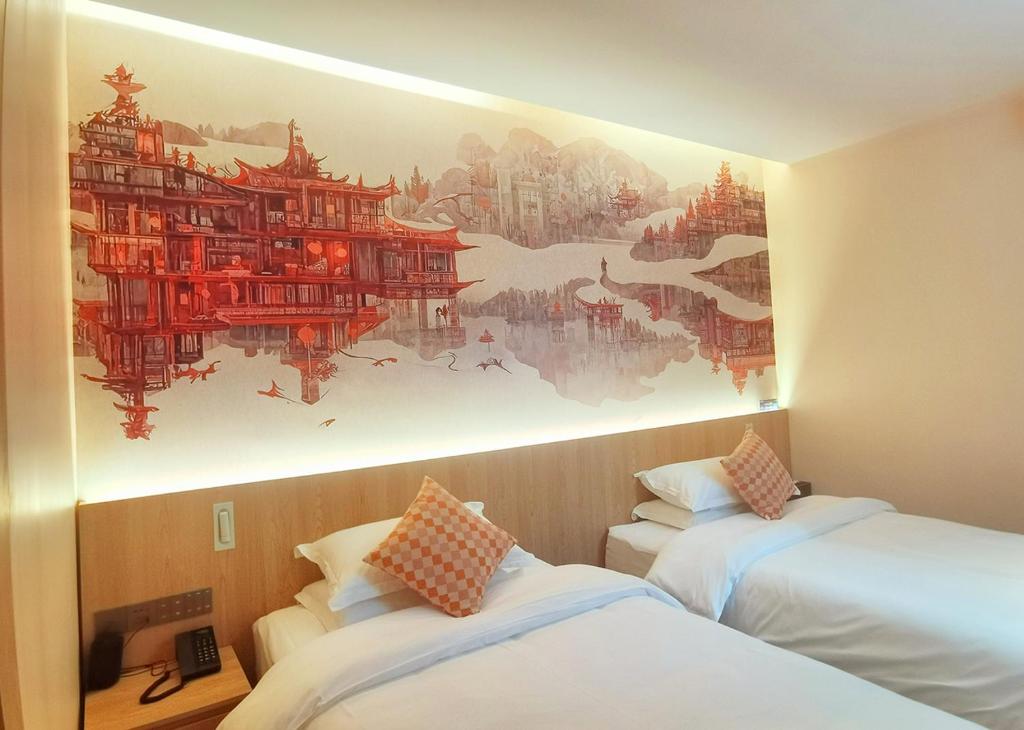 Postel nebo postele na pokoji v ubytování Andy International Hotel Shenzhen University Nanshan Metro Branch