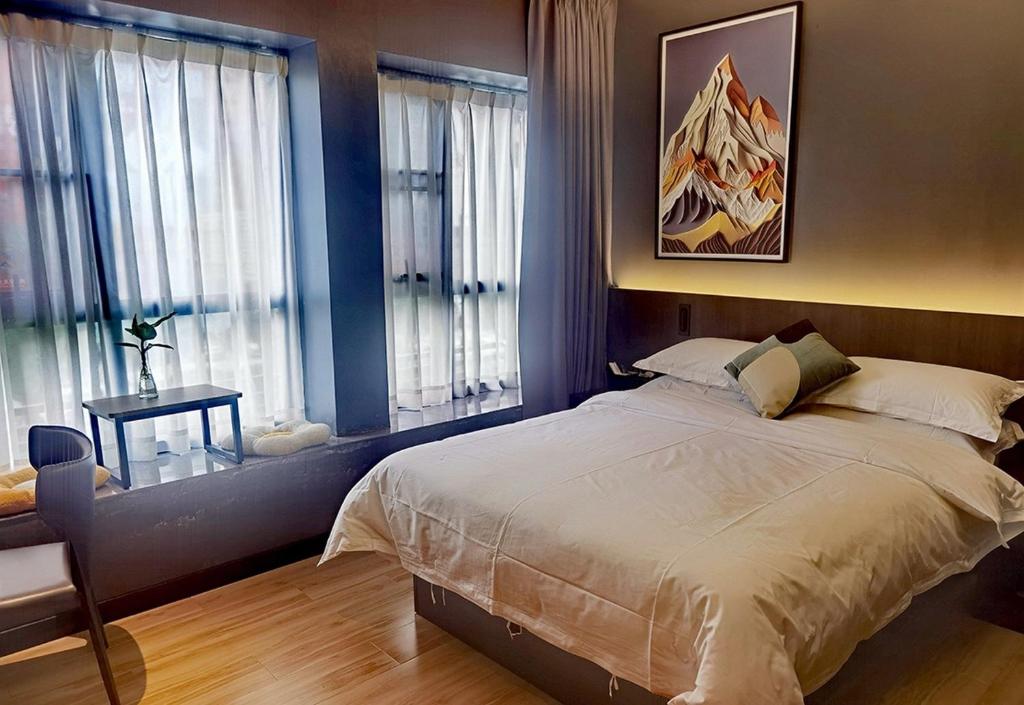 Postel nebo postele na pokoji v ubytování Andy International Hotel Shenzhen University Nanshan Metro Branch
