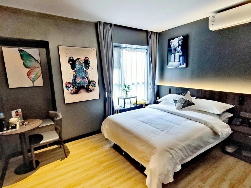 Postel nebo postele na pokoji v ubytování Andy International Hotel Shenzhen University Nanshan Metro Branch