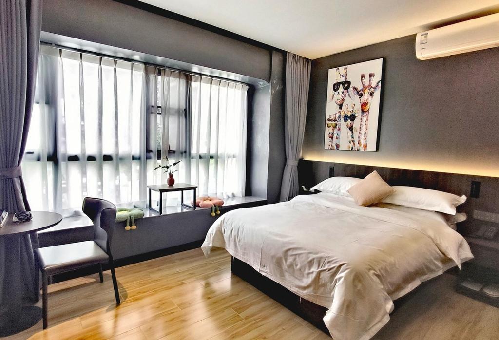 Postel nebo postele na pokoji v ubytování Andy International Hotel Shenzhen University Nanshan Metro Branch