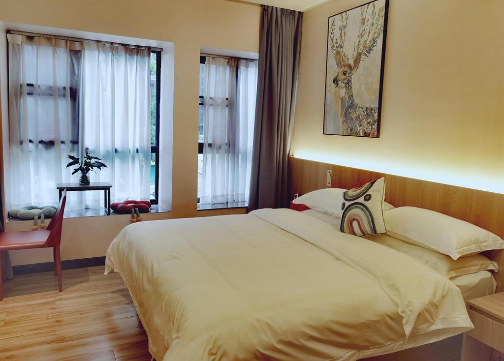 Postel nebo postele na pokoji v ubytování Andy International Hotel Shenzhen University Nanshan Metro Branch