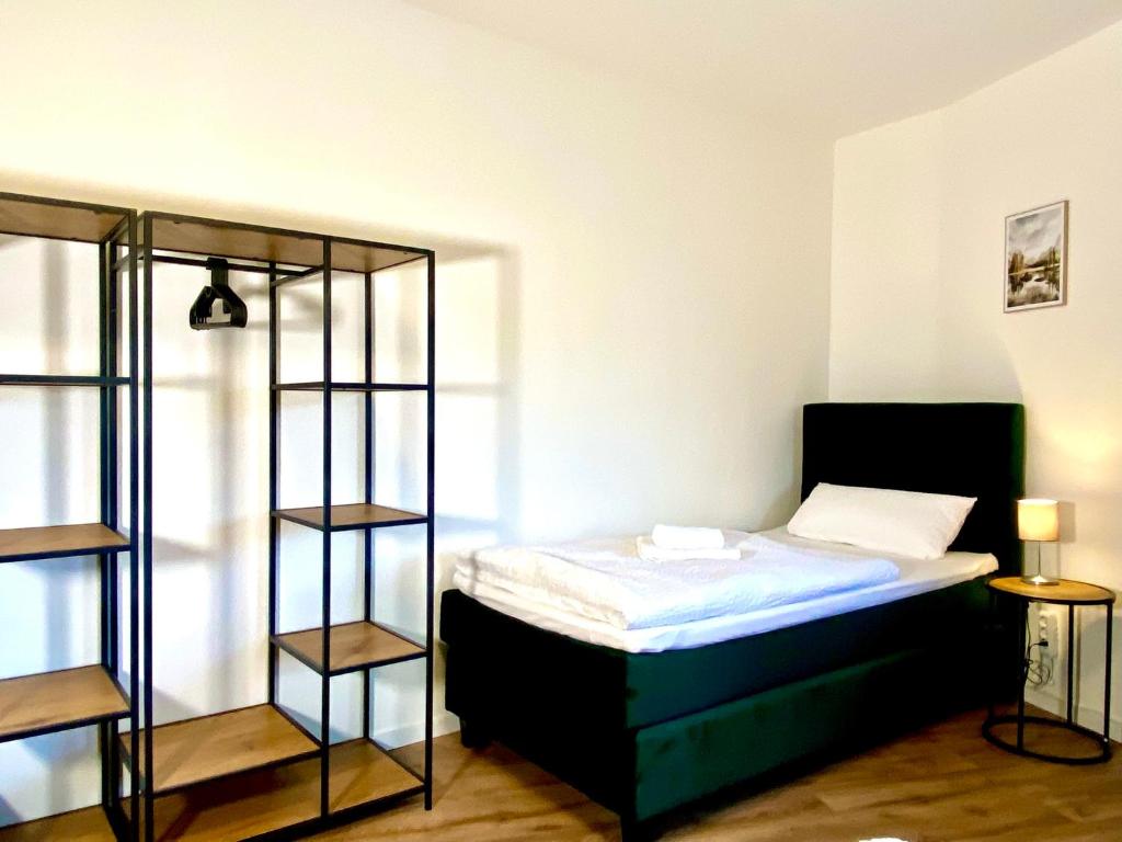 Postel nebo postele na pokoji v ubytování Gästehaus Bayreuth