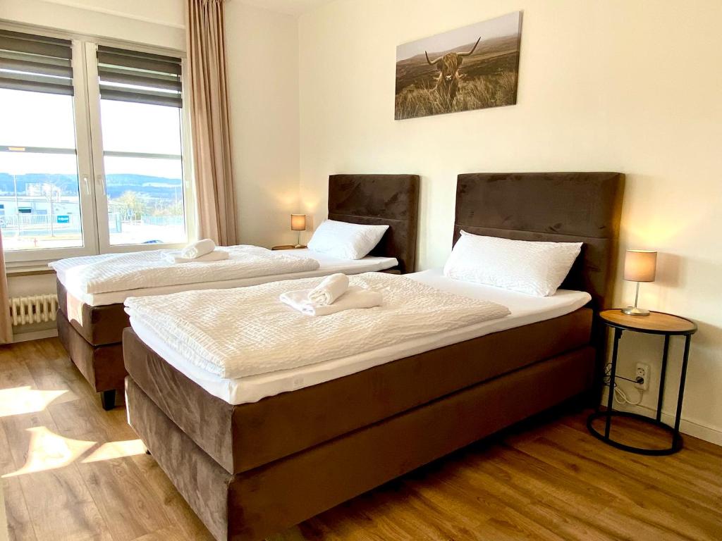 Postel nebo postele na pokoji v ubytování Gästehaus Bayreuth