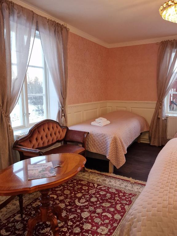 Säng eller sängar i ett rum på Svaneholm Hotel
