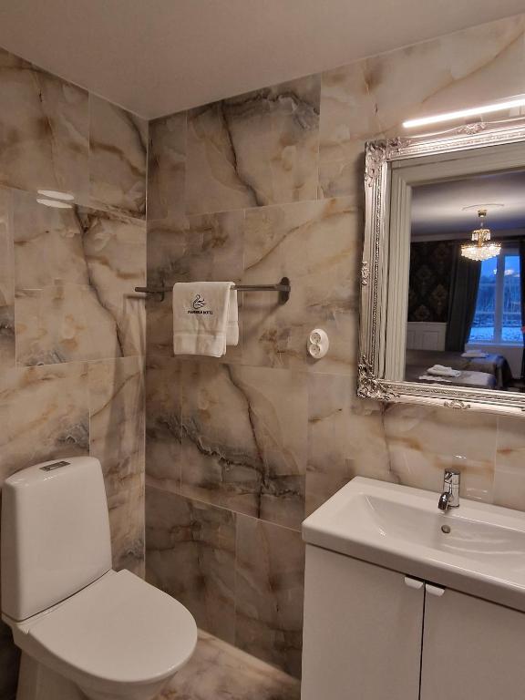 Ett badrum på Svaneholm Hotel